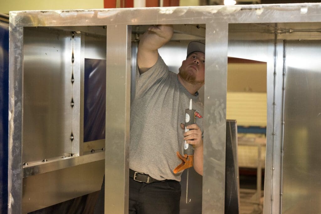 Production assembler working on a large desiccant dehumidifier at Bry-Air's manufacturing headquarters in Sunbury, Ohio